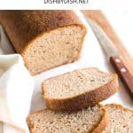 Sliced bread and a knife on a wooden board.