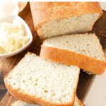 Spreading butter on sliced bread.