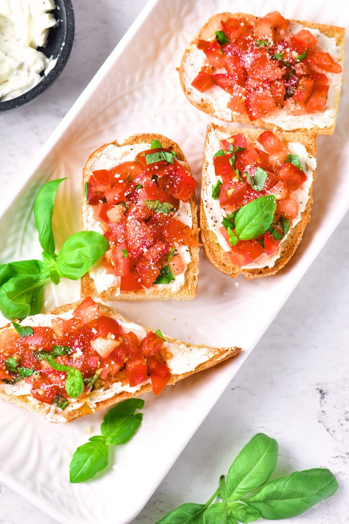 Gluten-free bruchetta bread on serving platter.