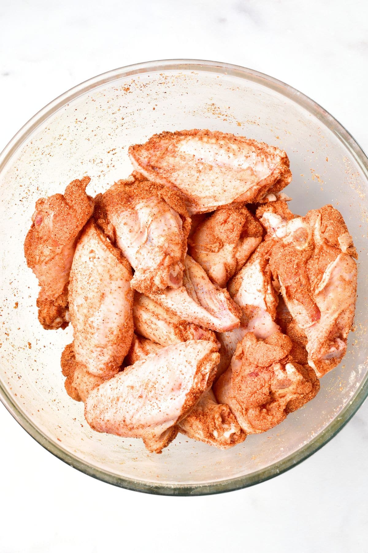 Buffalo wings tossed in seasoning mixture