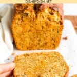 Hand reaching for a slice of carrot bread.