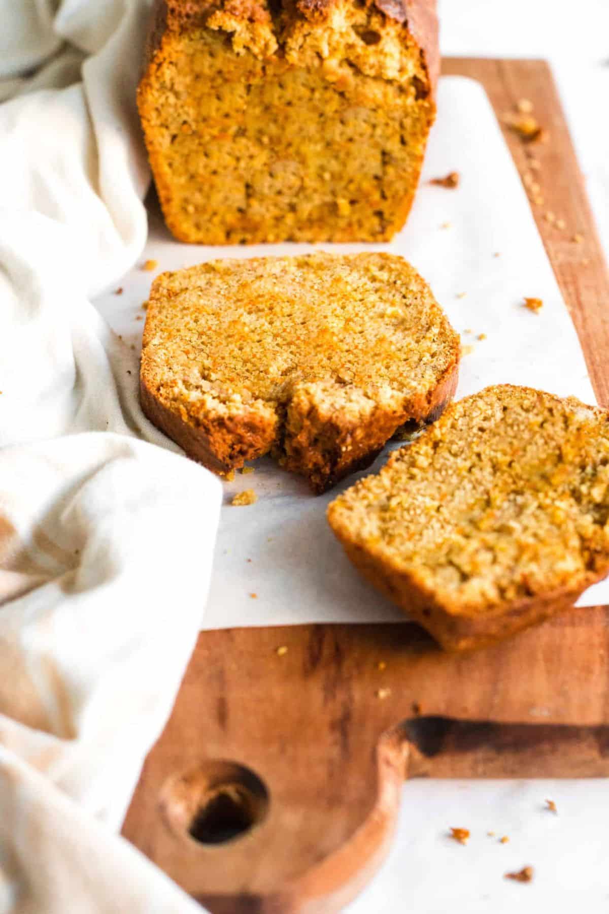 Sliced pieces of carrot loaf on parchment.