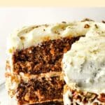 Half-eaten glute-free dairy-free carrot cake on cake stand.