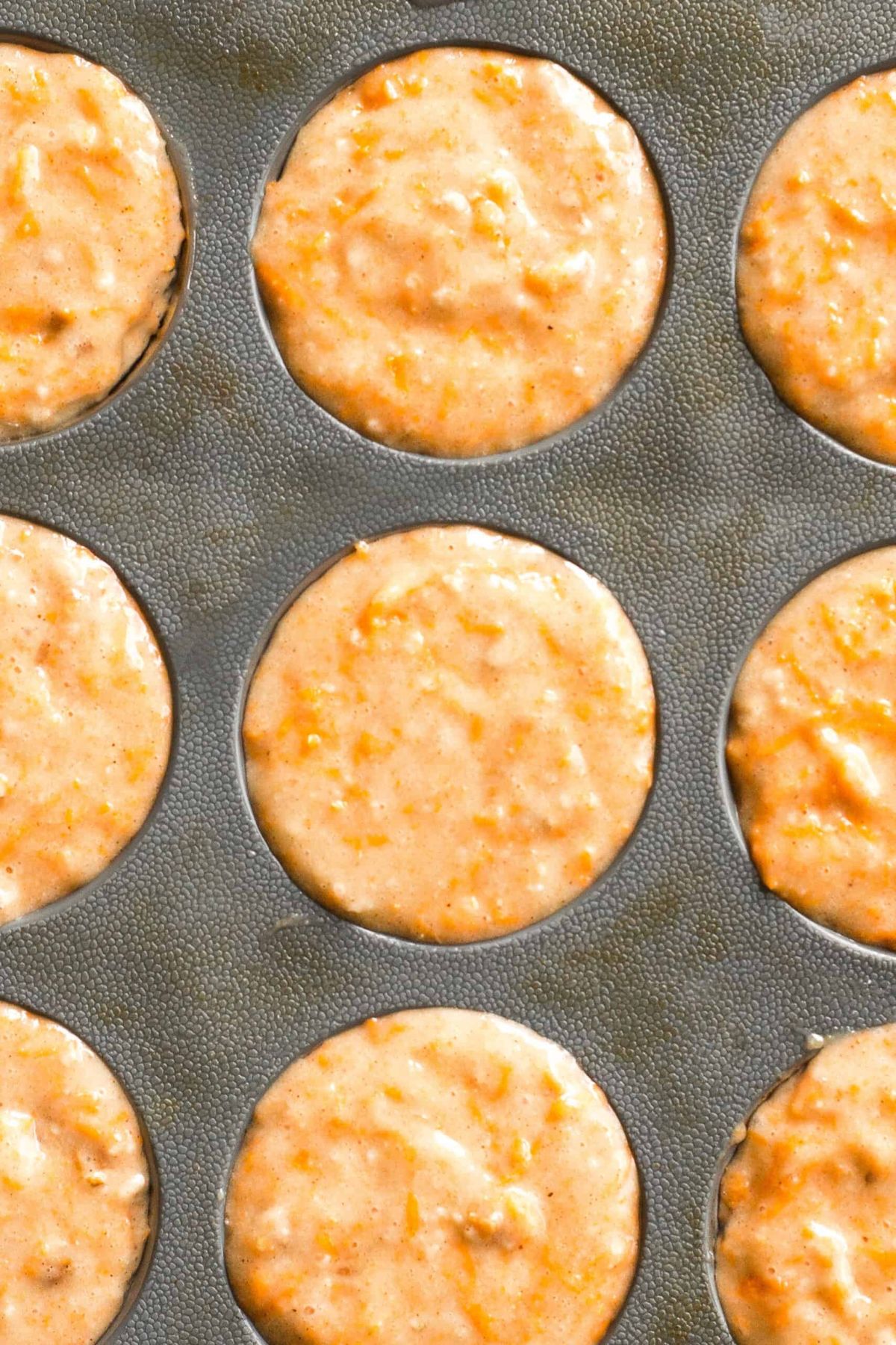 Carrot muffin batter in silicon muffin mold