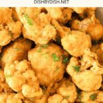 Up close view of crispy cauliflower florets fried in batter.