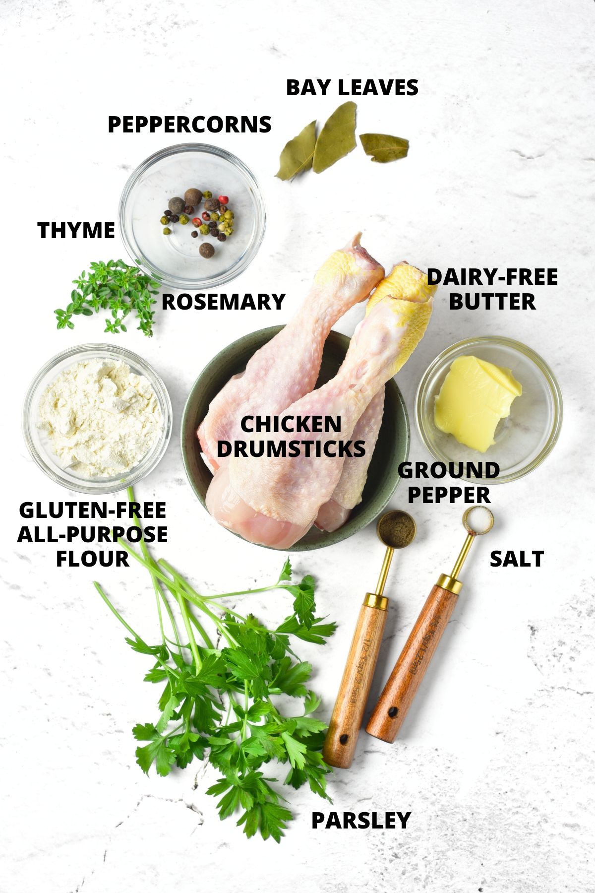 Ingredients for gluten-free chicken gravy recipe laid out on marble board.
