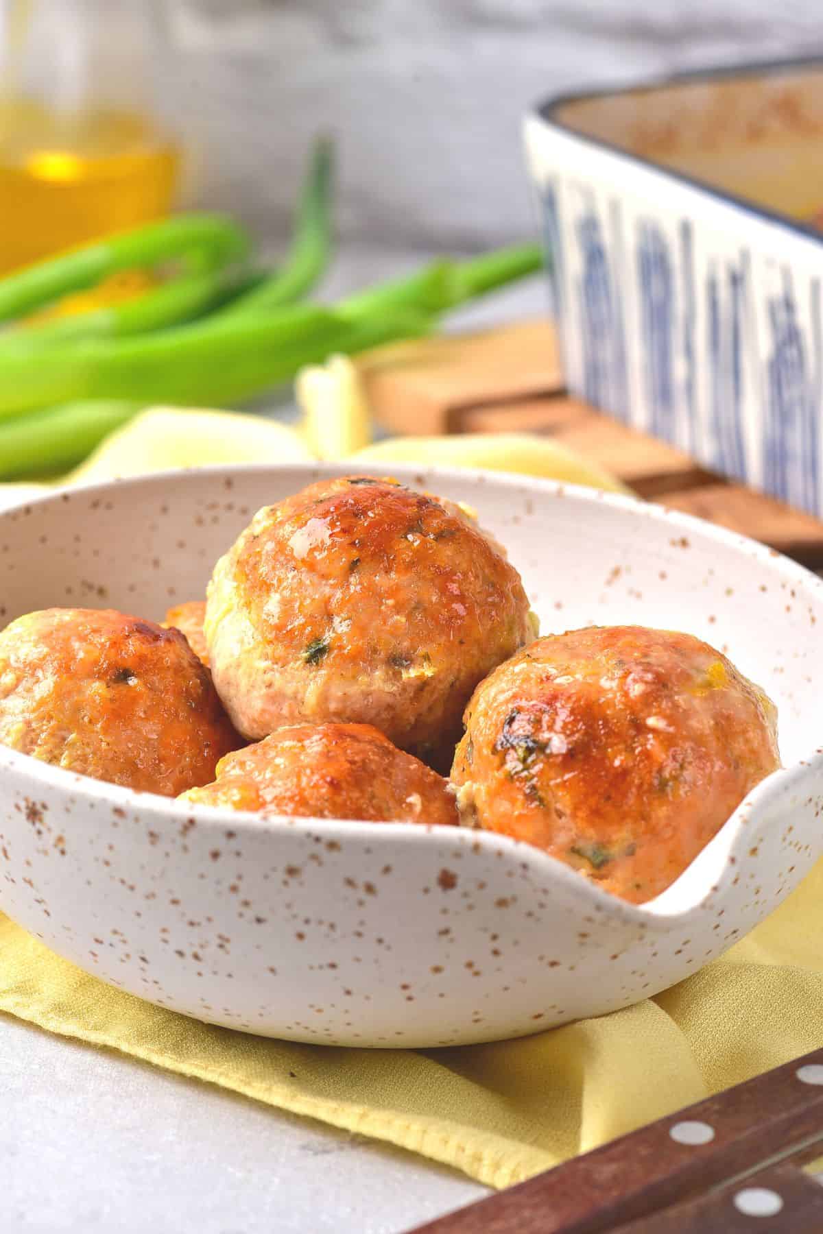 Up close shot of chicken balls in a bowl.