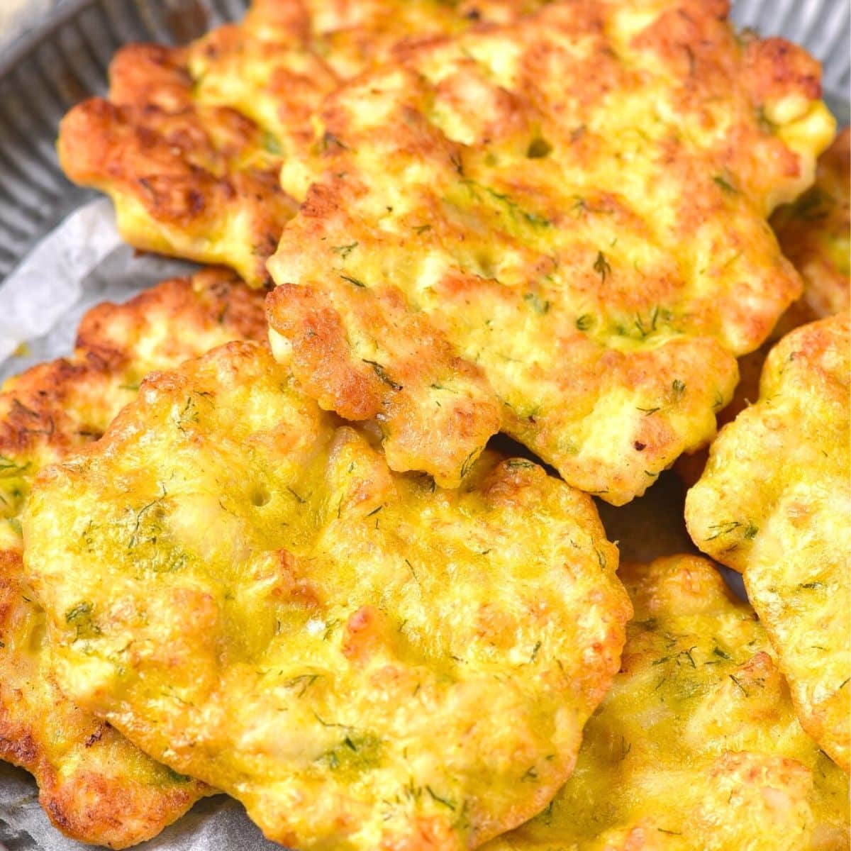 GF chicken patties on metal plate.