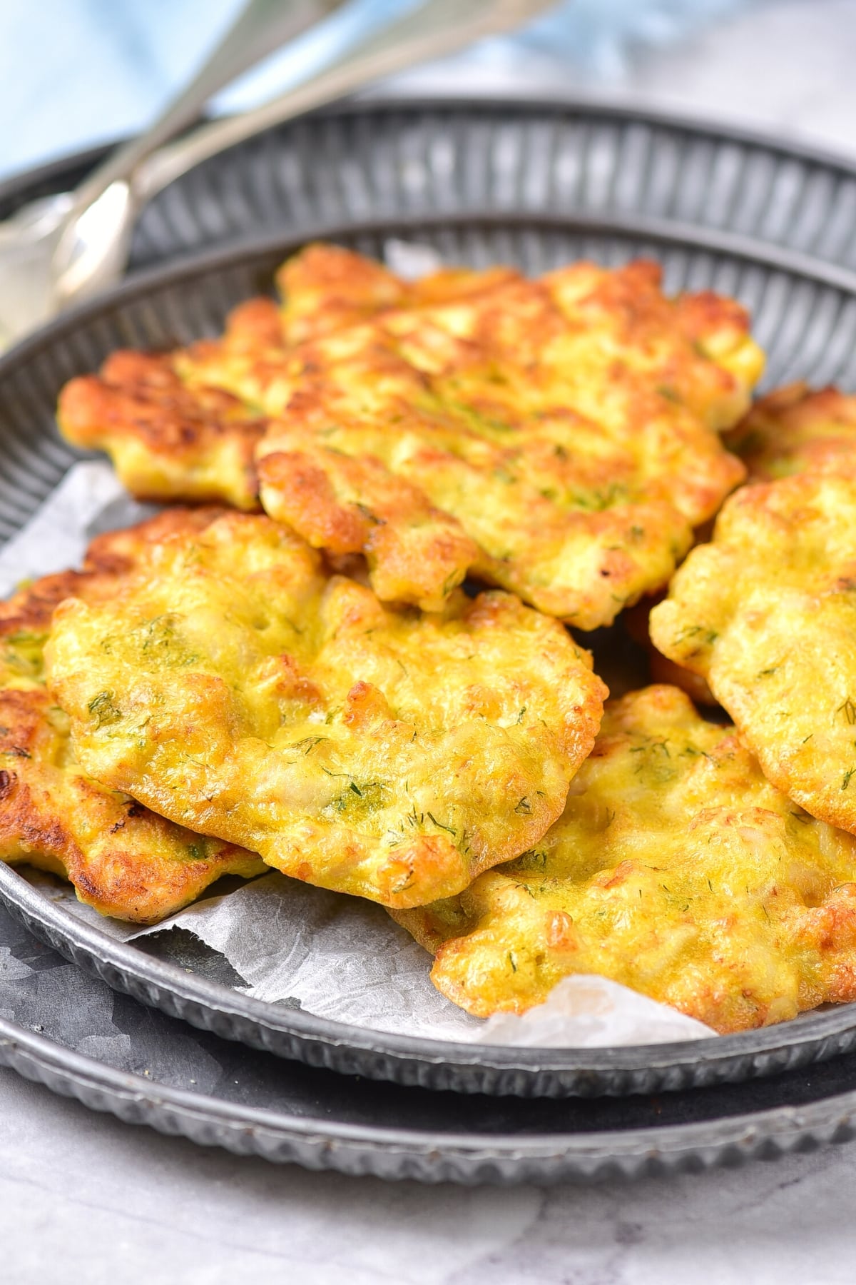 Air Fryer Chicken Patties on parchment-lined plates.