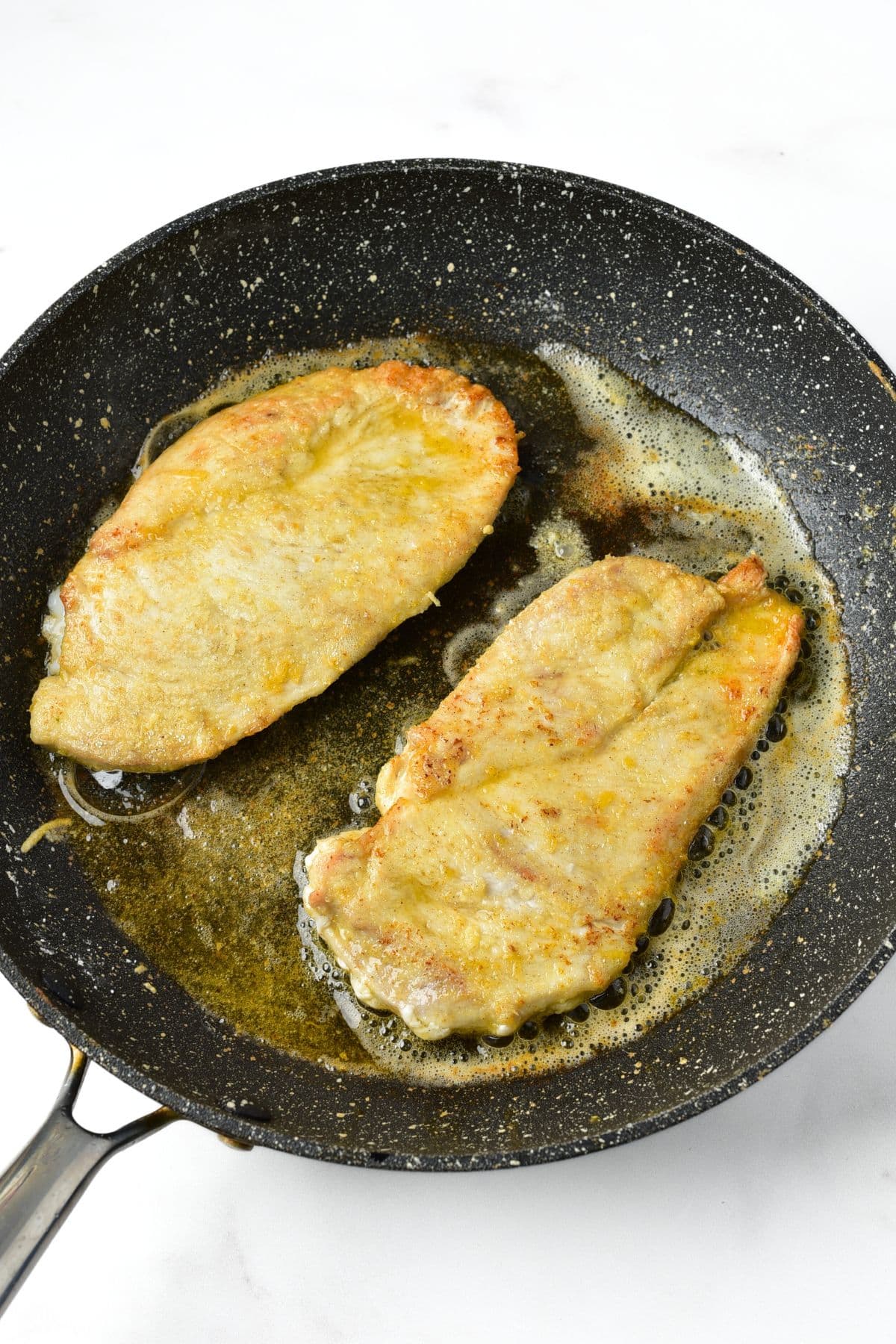 Searing chicken cutlets in skillet