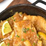 Lemon chicken piccata in cast iron skillet.