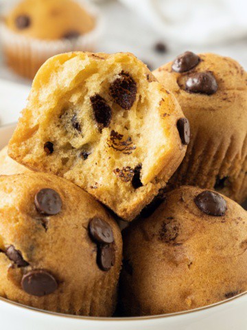 Up close shot of a half-eaten chocolate chip muffin.