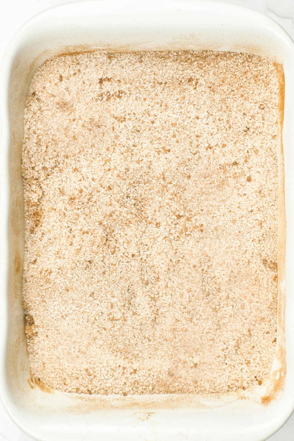 A baking dish with cinnamon sugar.