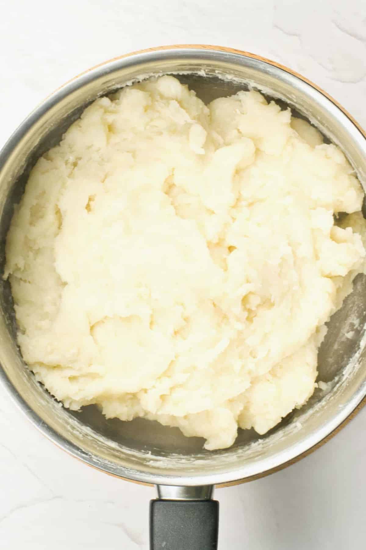 Churro dough in pot.