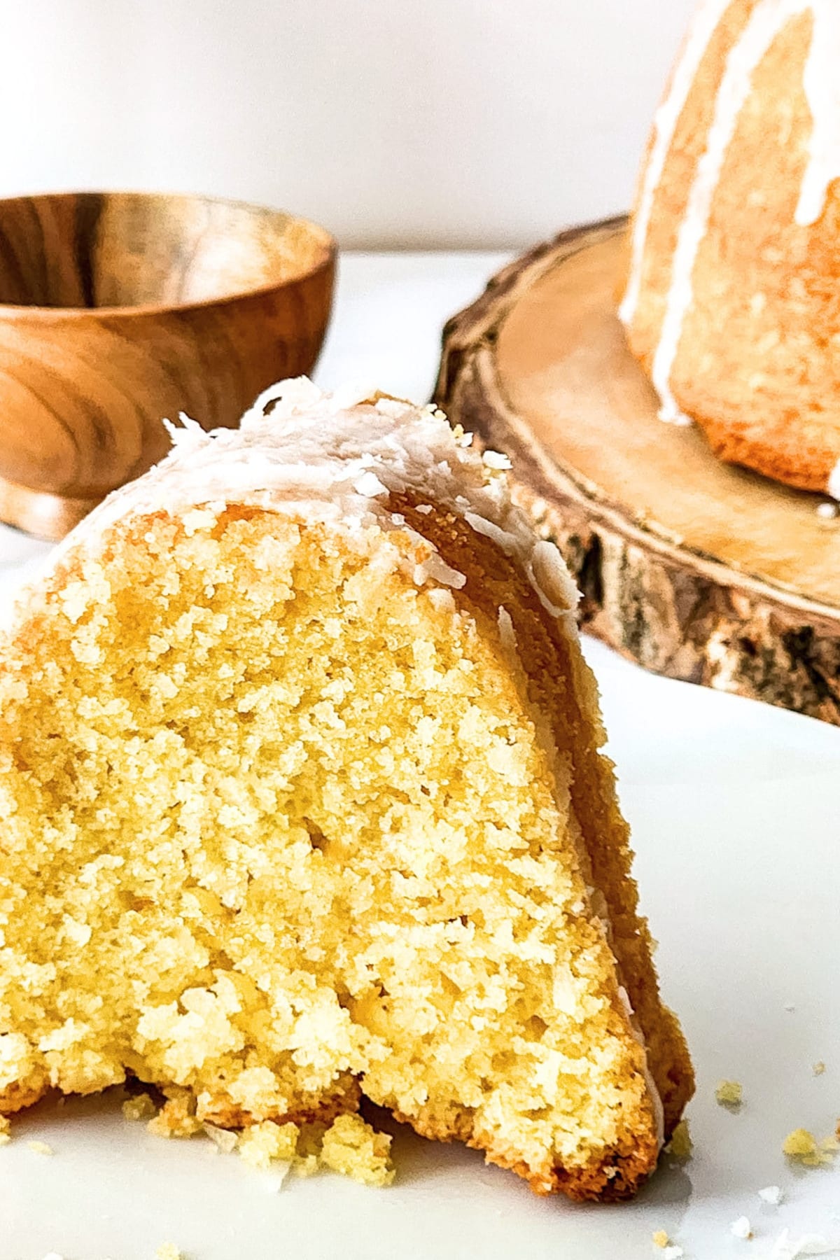 Half-sliced coconut bundt cake.