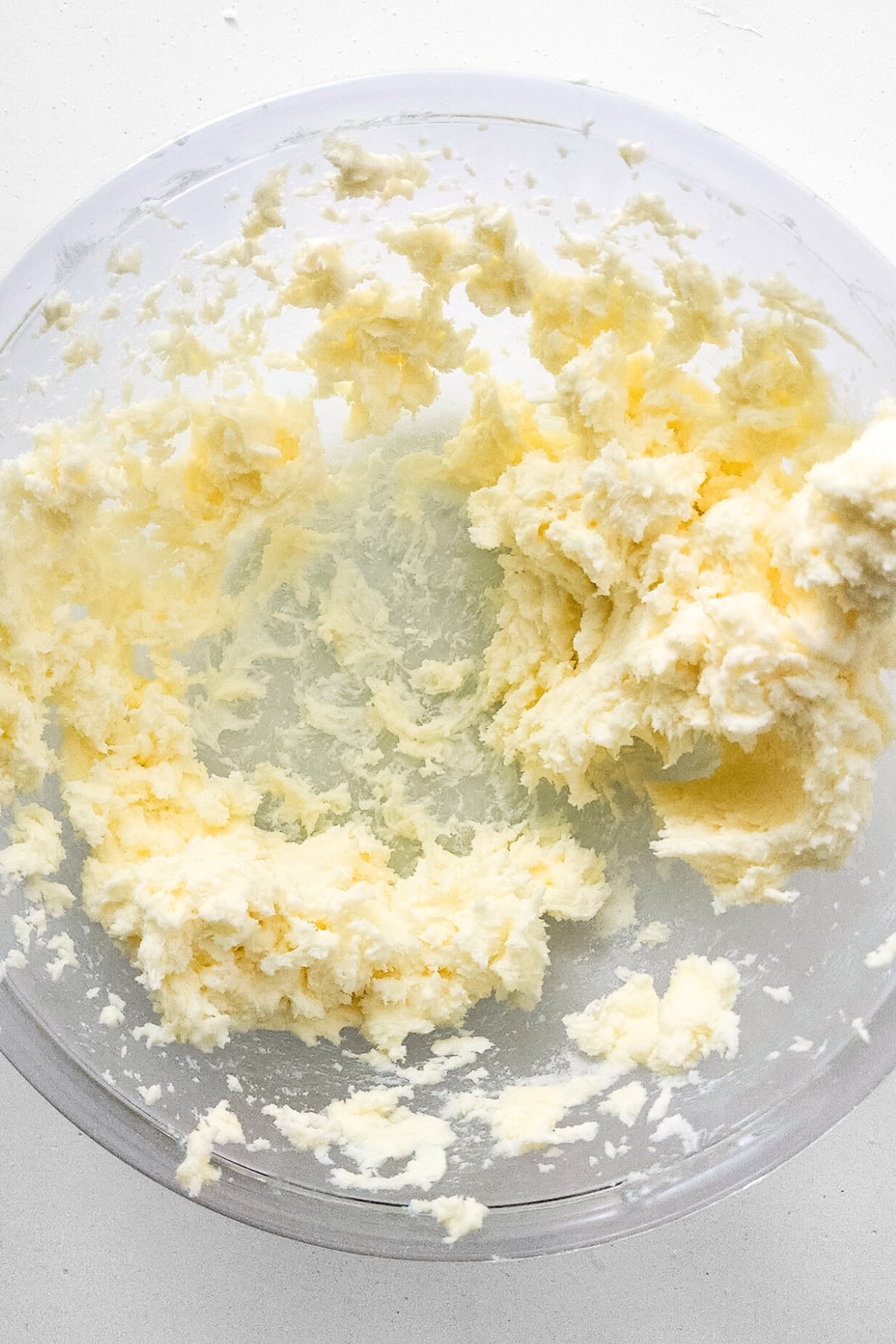 Sugar butter mixture in glass bowl.
