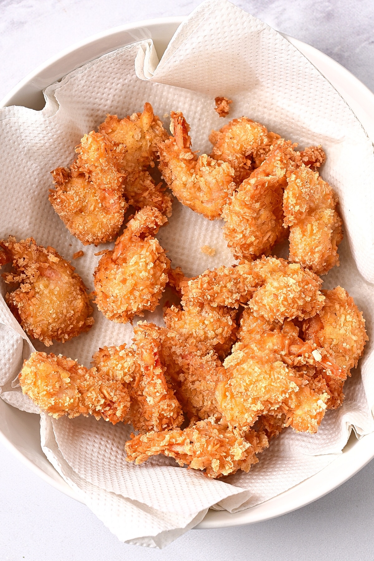 Freshly cooked crispy coconut shrimp (gluten-free).