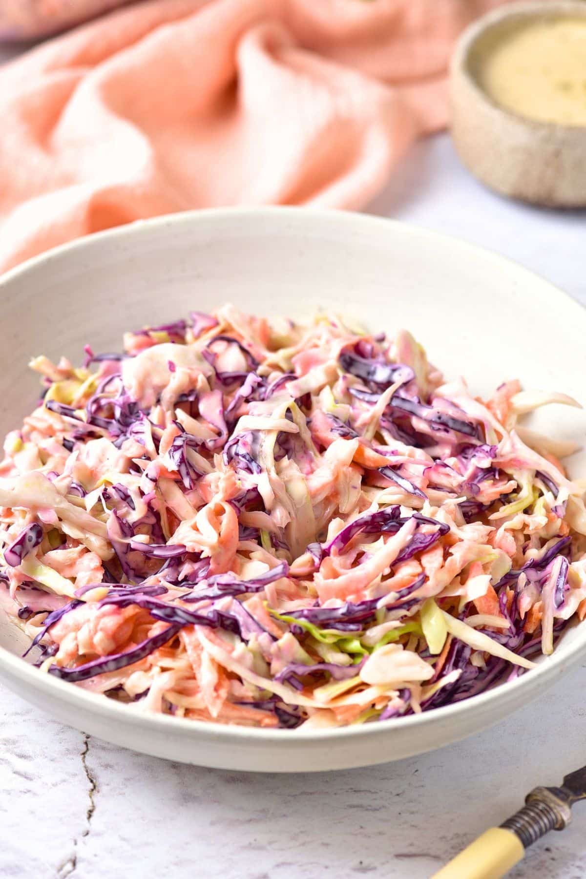 Up close view of a bowl of gluten-free dairy-free coleslaw.