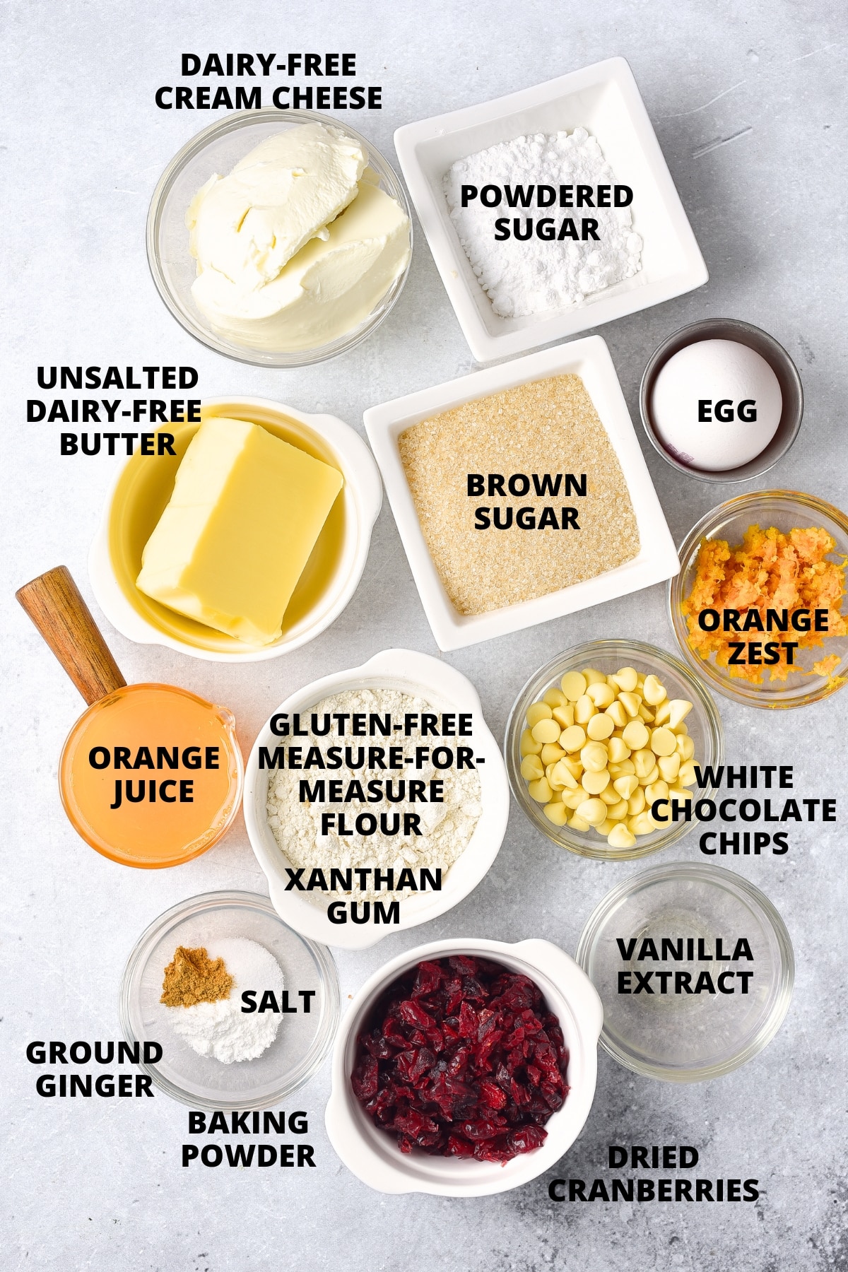 Ingredients for cranberry bliss bars recipe laid out on marble board.