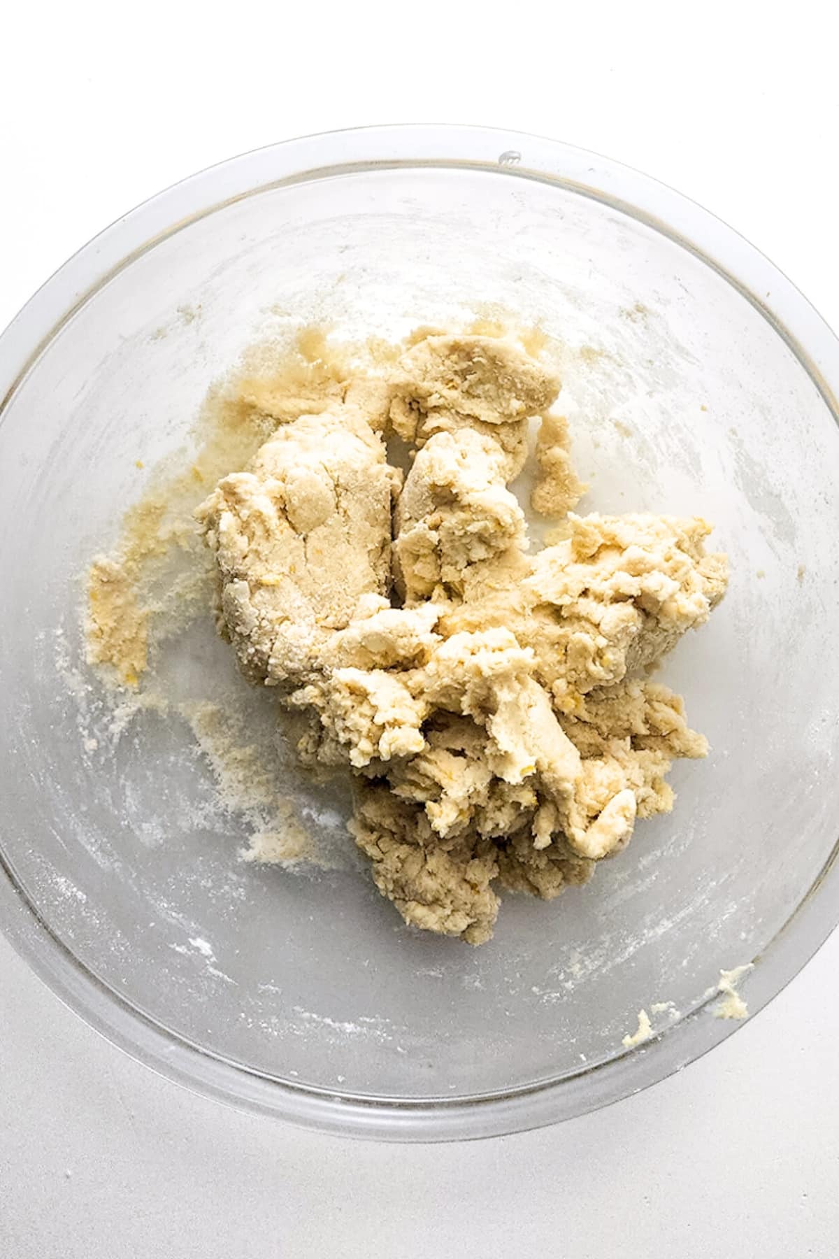 Gluten-free scone dough in glass mixing bowl.