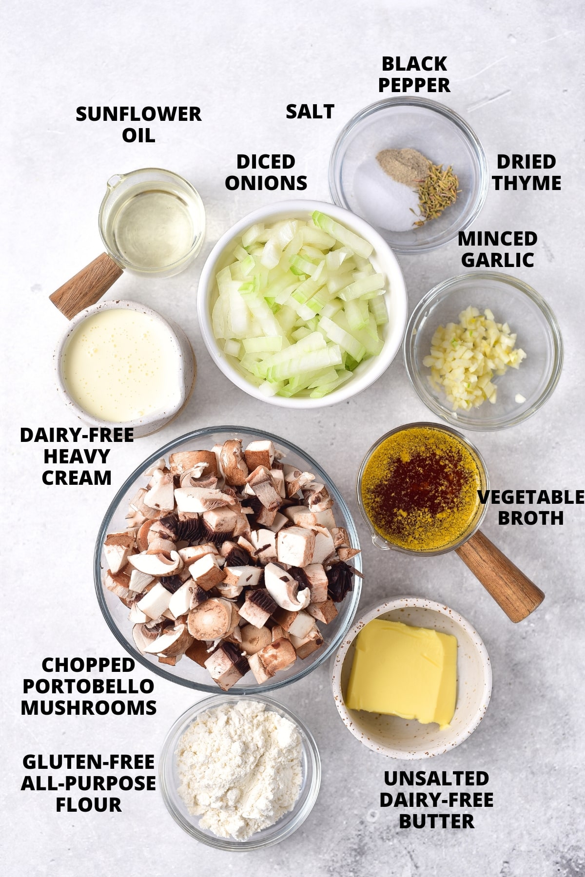 Ingredients for gluten-free cream of mushroom soup recipe laid out on marble board.