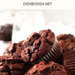 A plate of double chocolate muffins and a glass of milk.