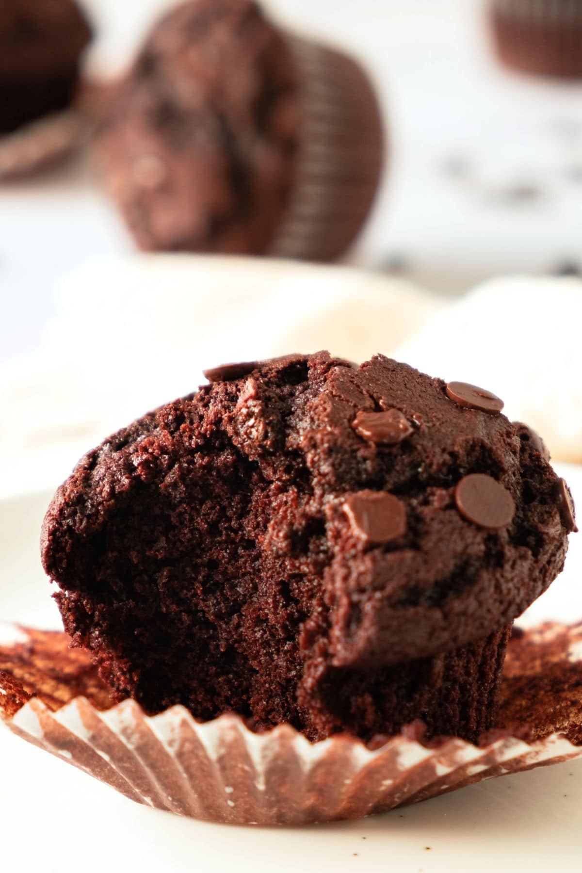 Up close view of half-eaten gf chocolate muffin