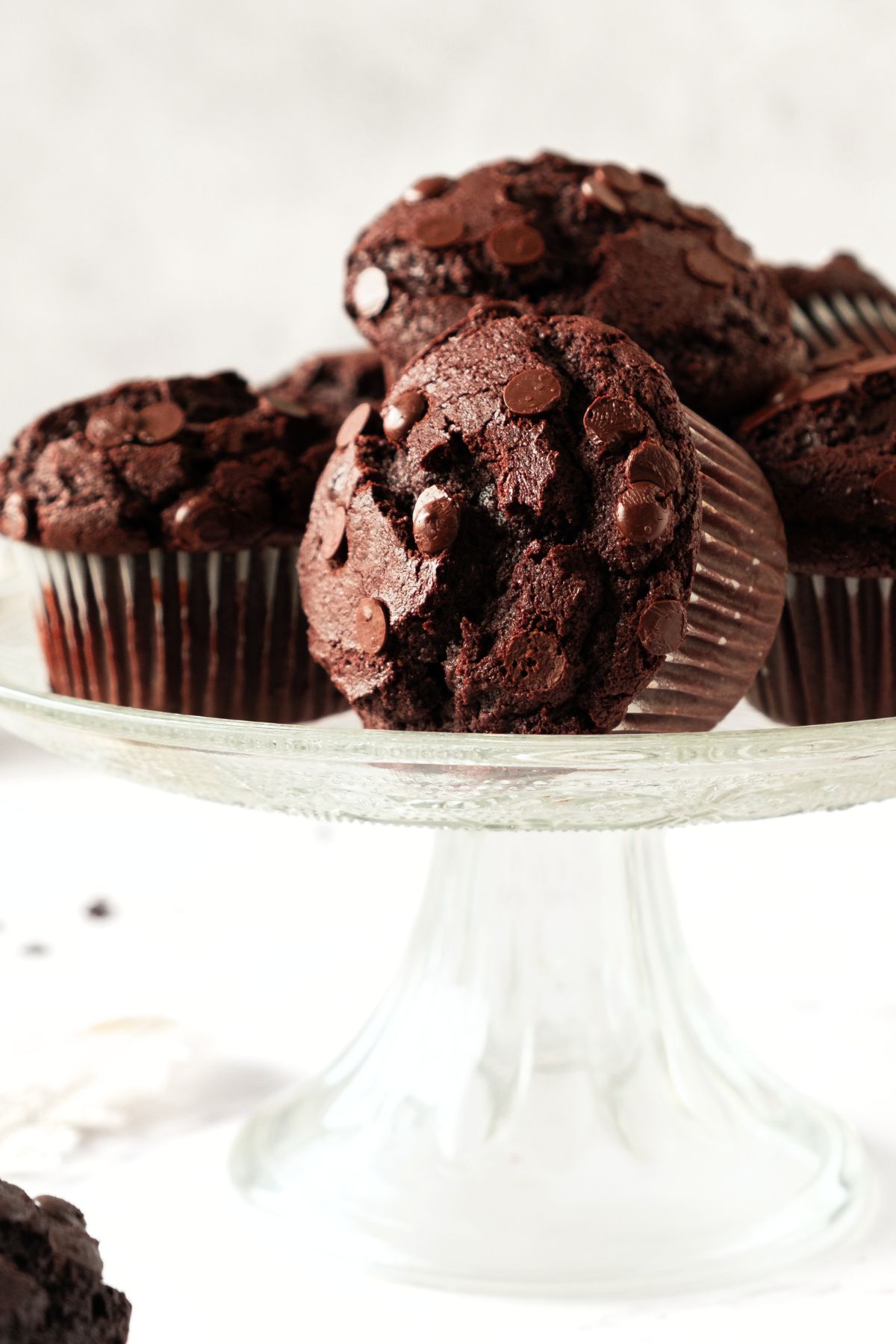 Gluten-free double chocolate muffins on cake stand
