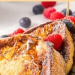 Pouring maple syrup over pieces of French toasts.