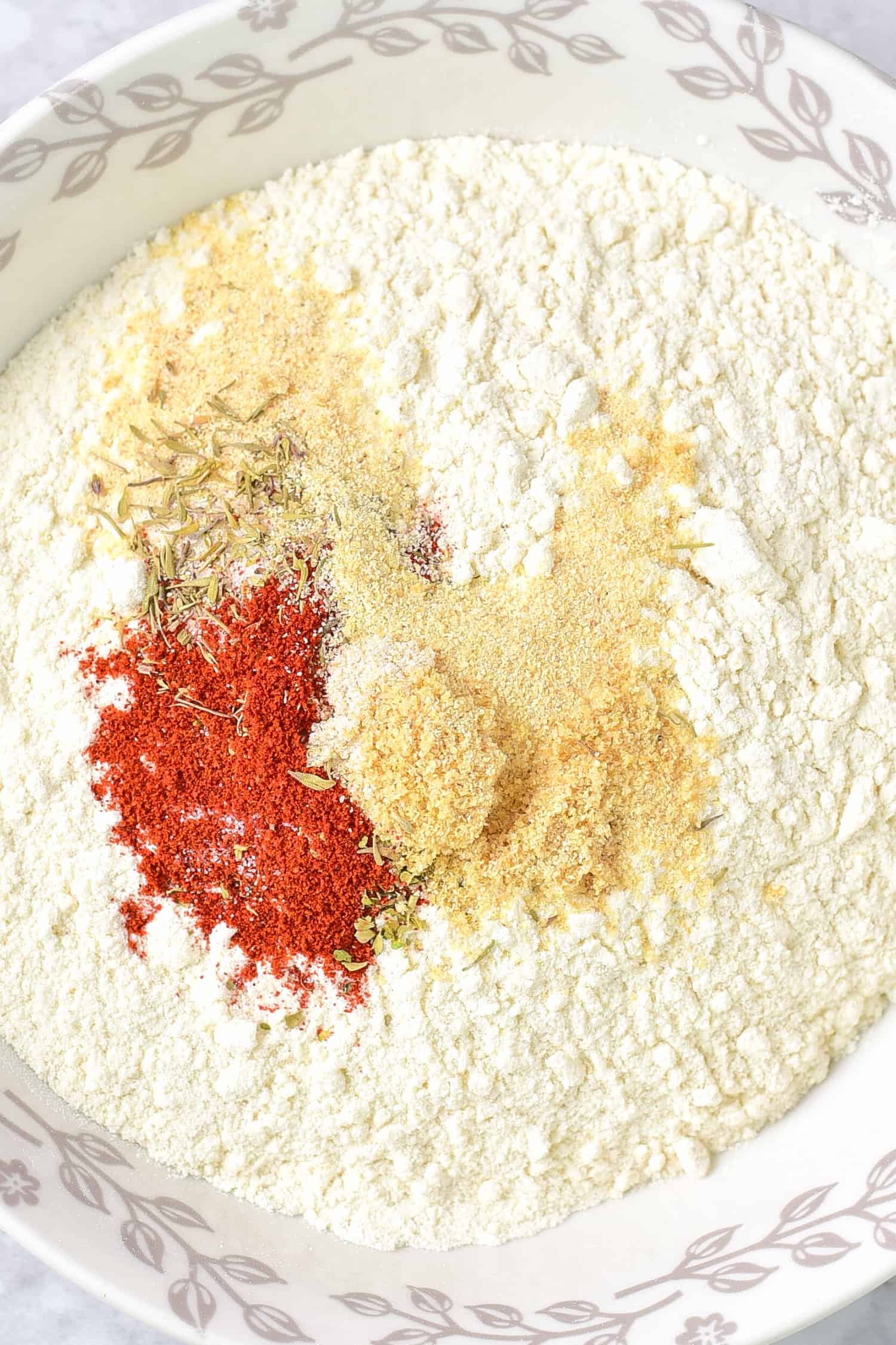 A bowl with flour and spices.