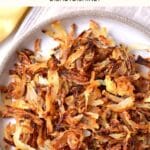 Top down view of a plate of gluten-free fried onions.