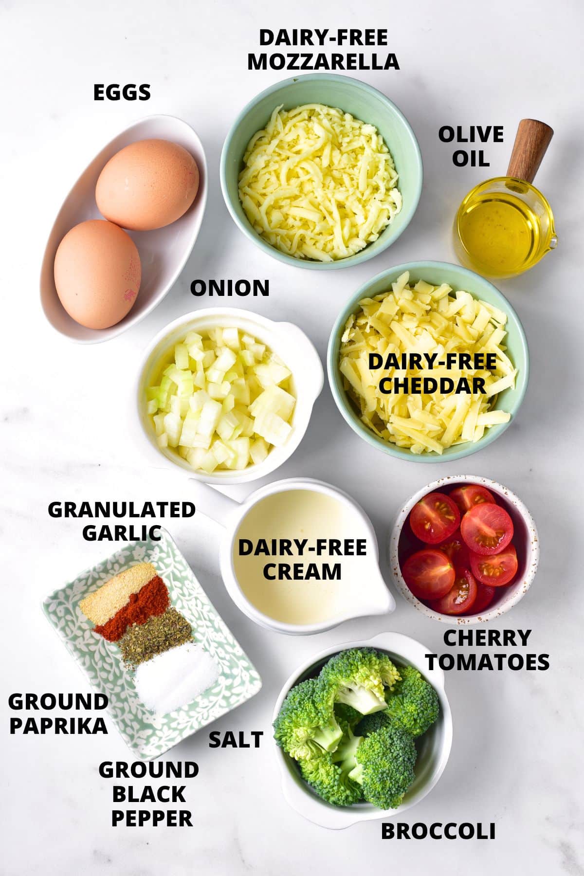 Ingredients for gluten-free frittata recipe laid out on marble board.