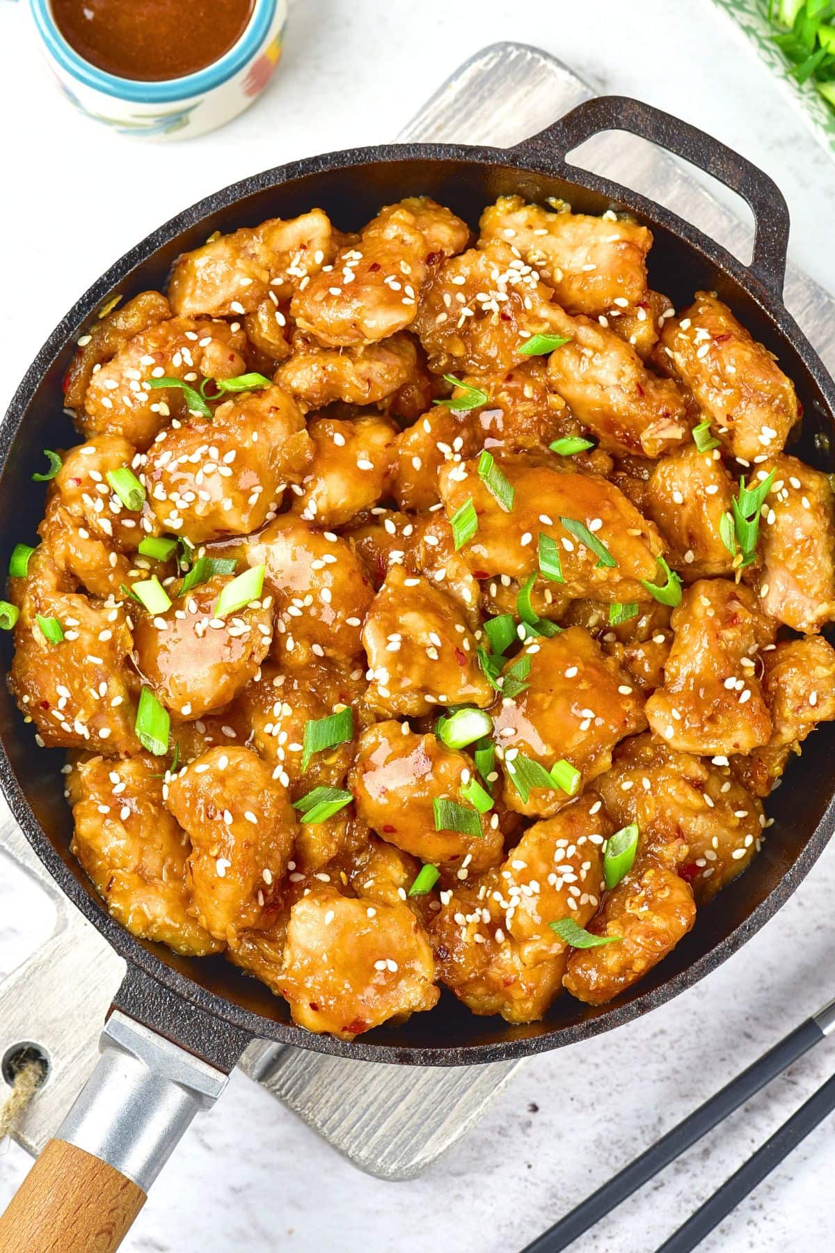 Top down view of skillet with gluten-free General Tso's chicken