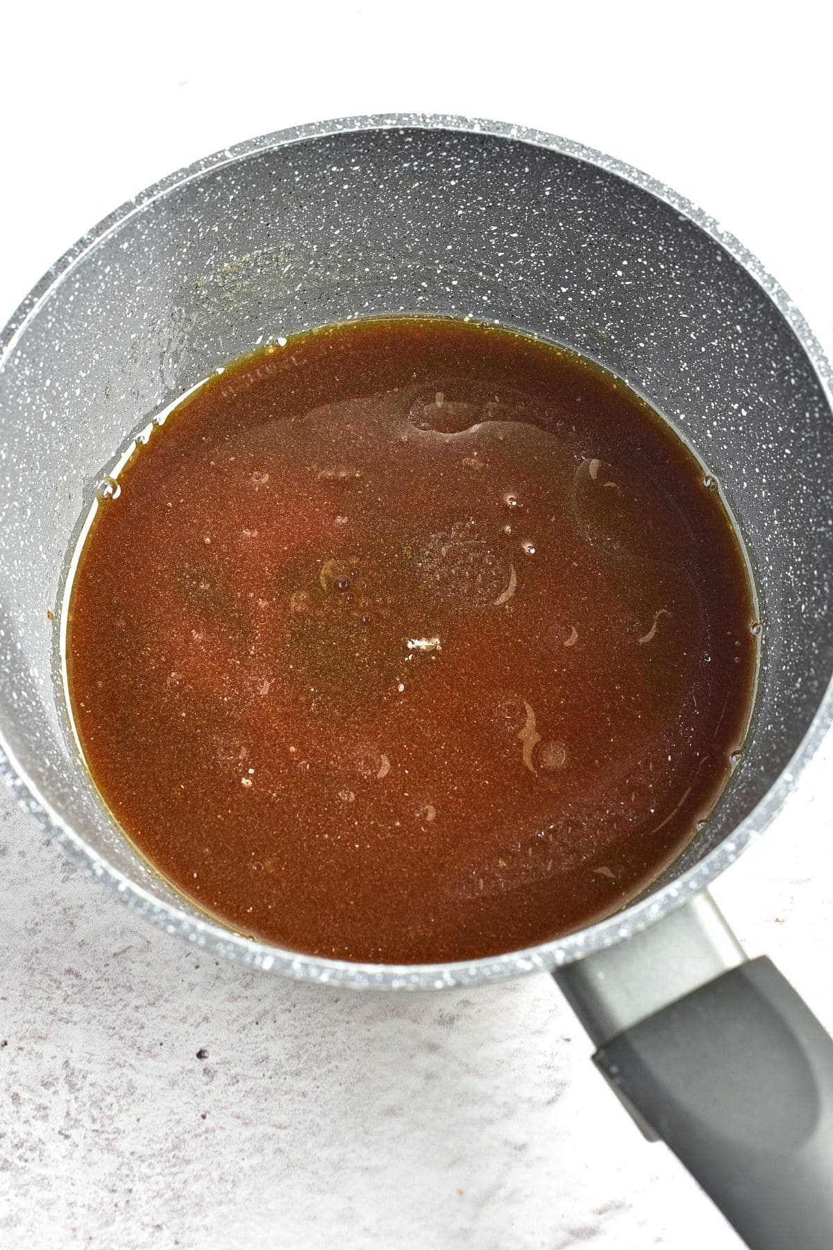 Brown sauce in saucepan