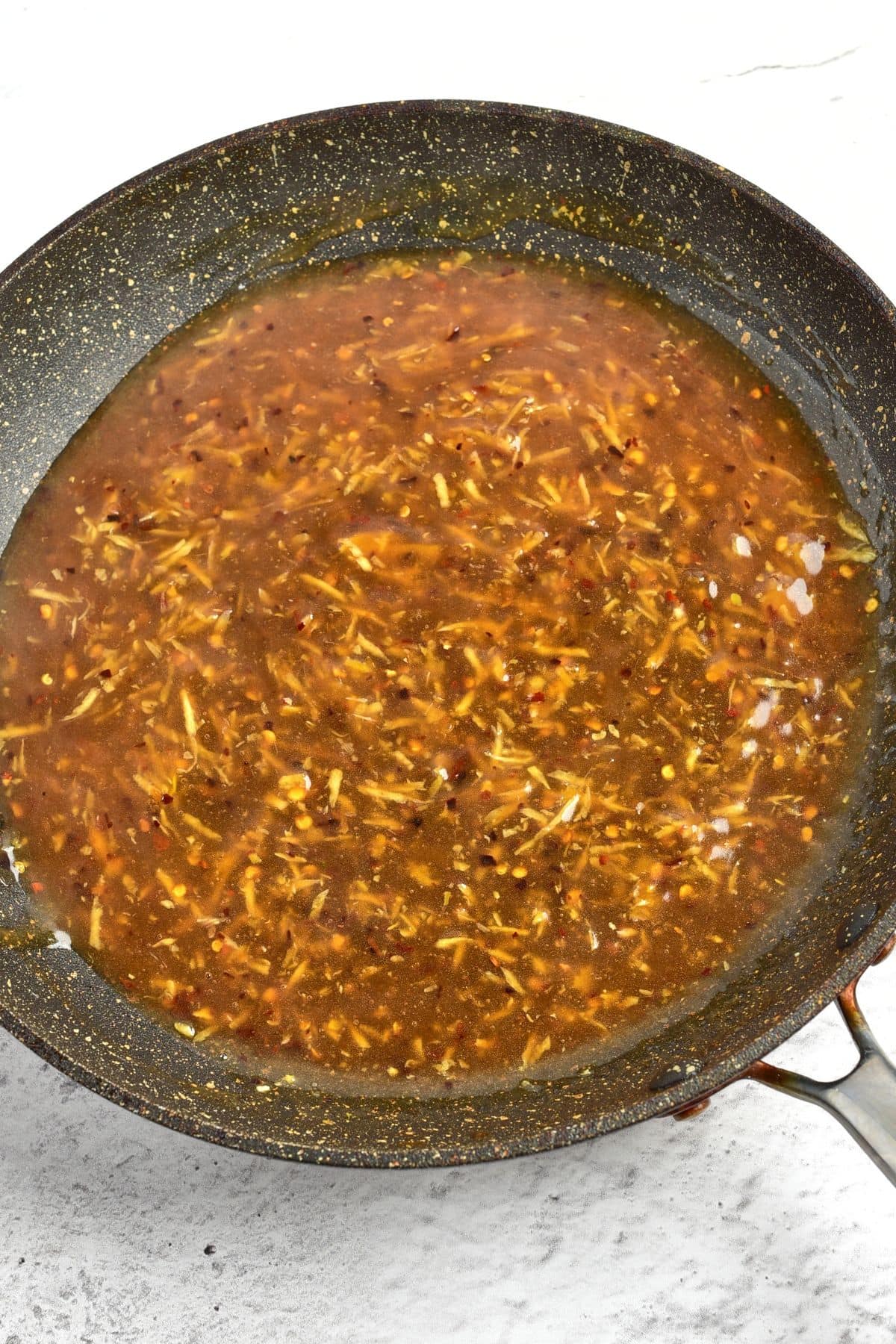 Brown liquid mixture in skillet