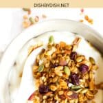 A bowl of yogurt topped with granola.