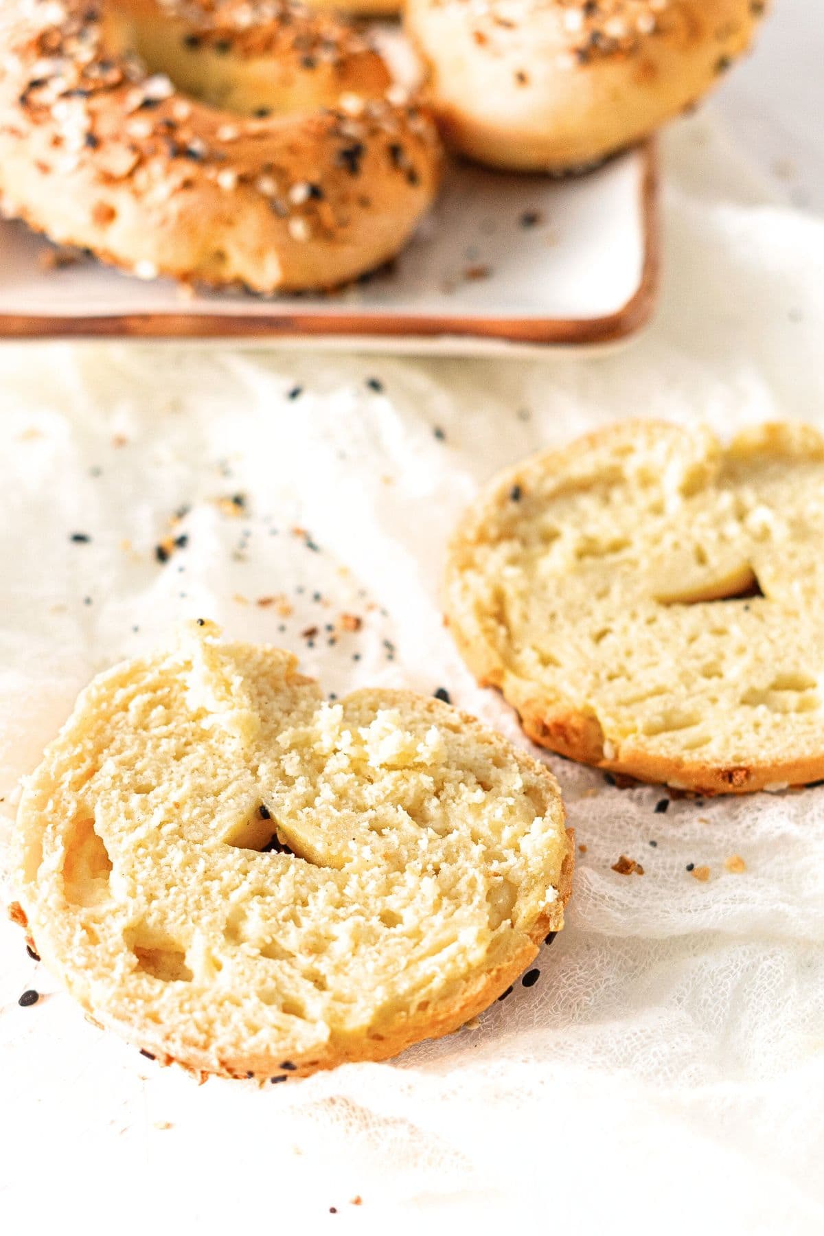 Sliced gluten-free Greek yogurt bagels on kitchen towel