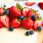 Top down view of cheesecake topped with fresh berries