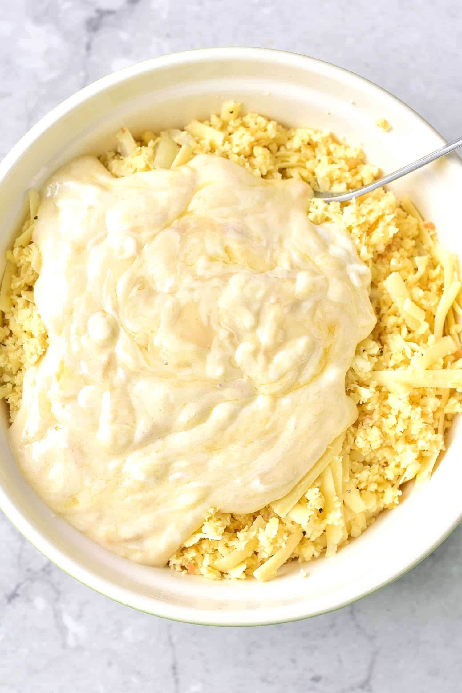 Wet ingredients on top of dry ingredients in bowl.