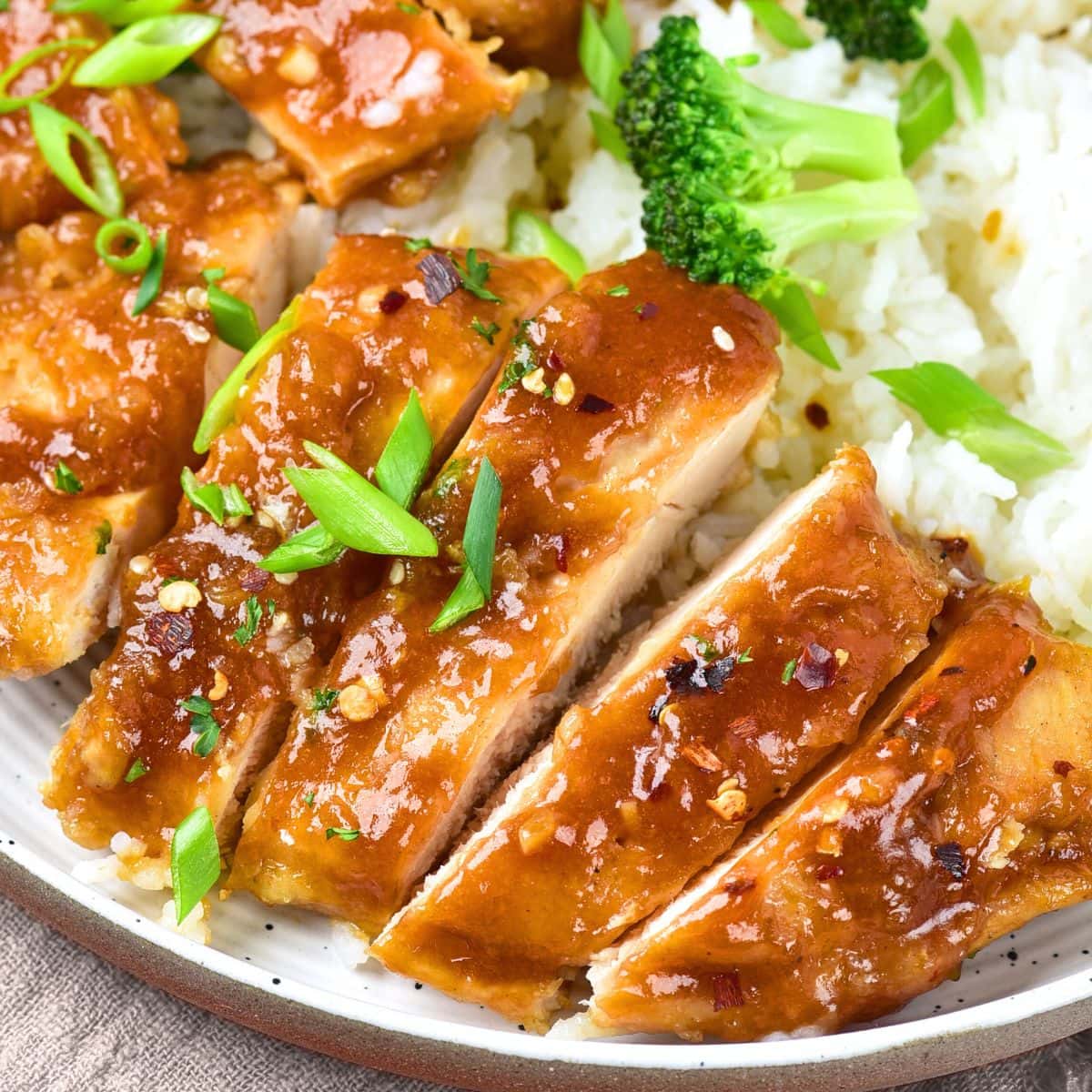 A plate of honey garlic chicken and rice