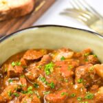 A bowl of Irish beef stew and sliced bread
