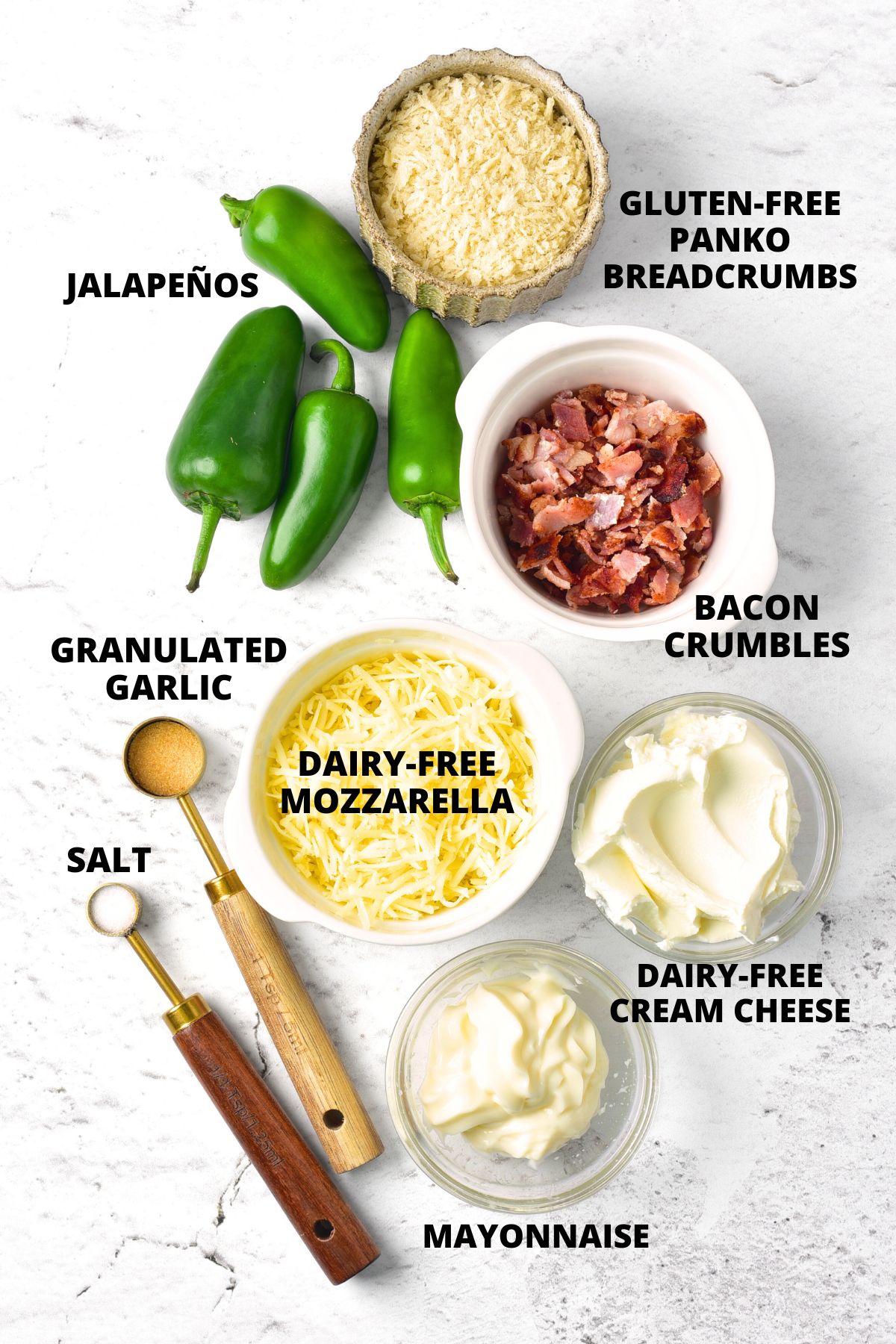 Ingredients for gluten-free jalapeño poppers laid out on marble board.