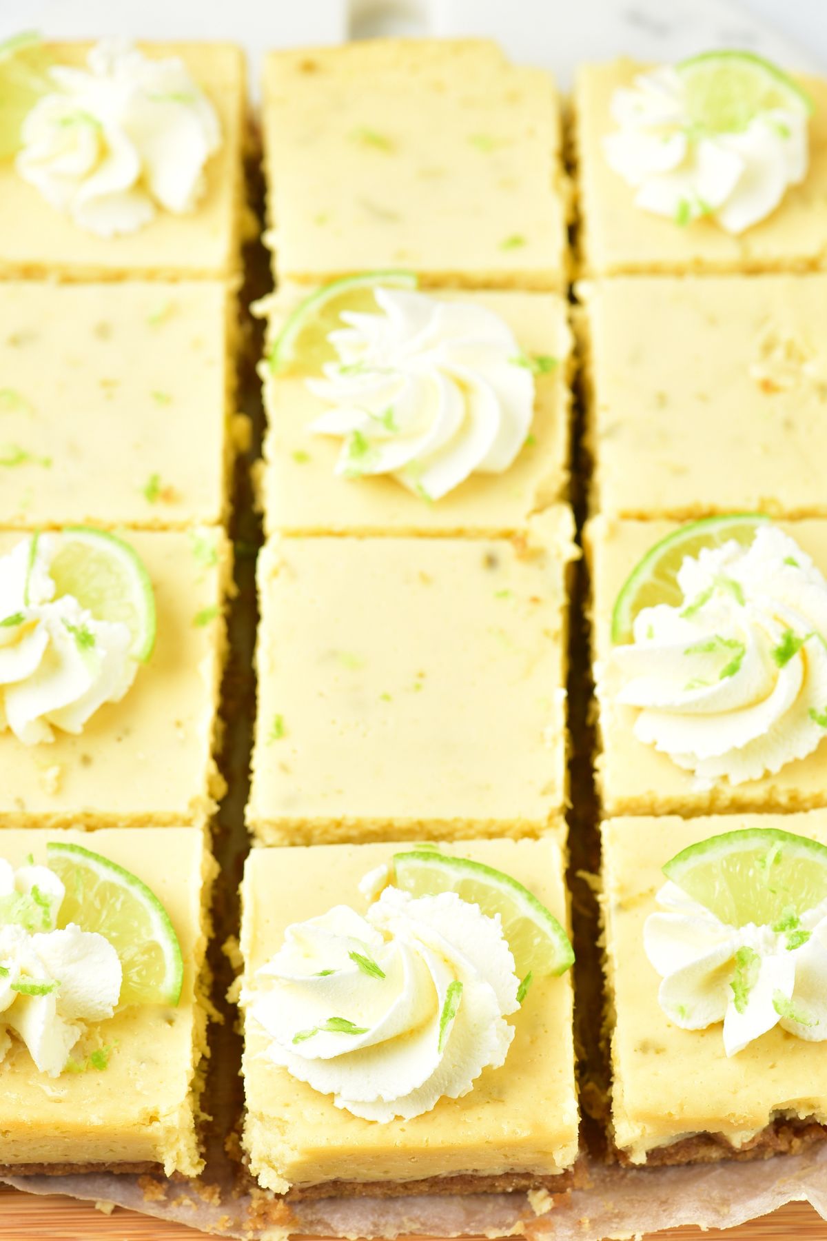 Key lime squares topped with whipped cream