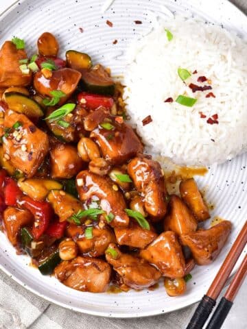 A plate of gluten-free kung pao chicken and rice.