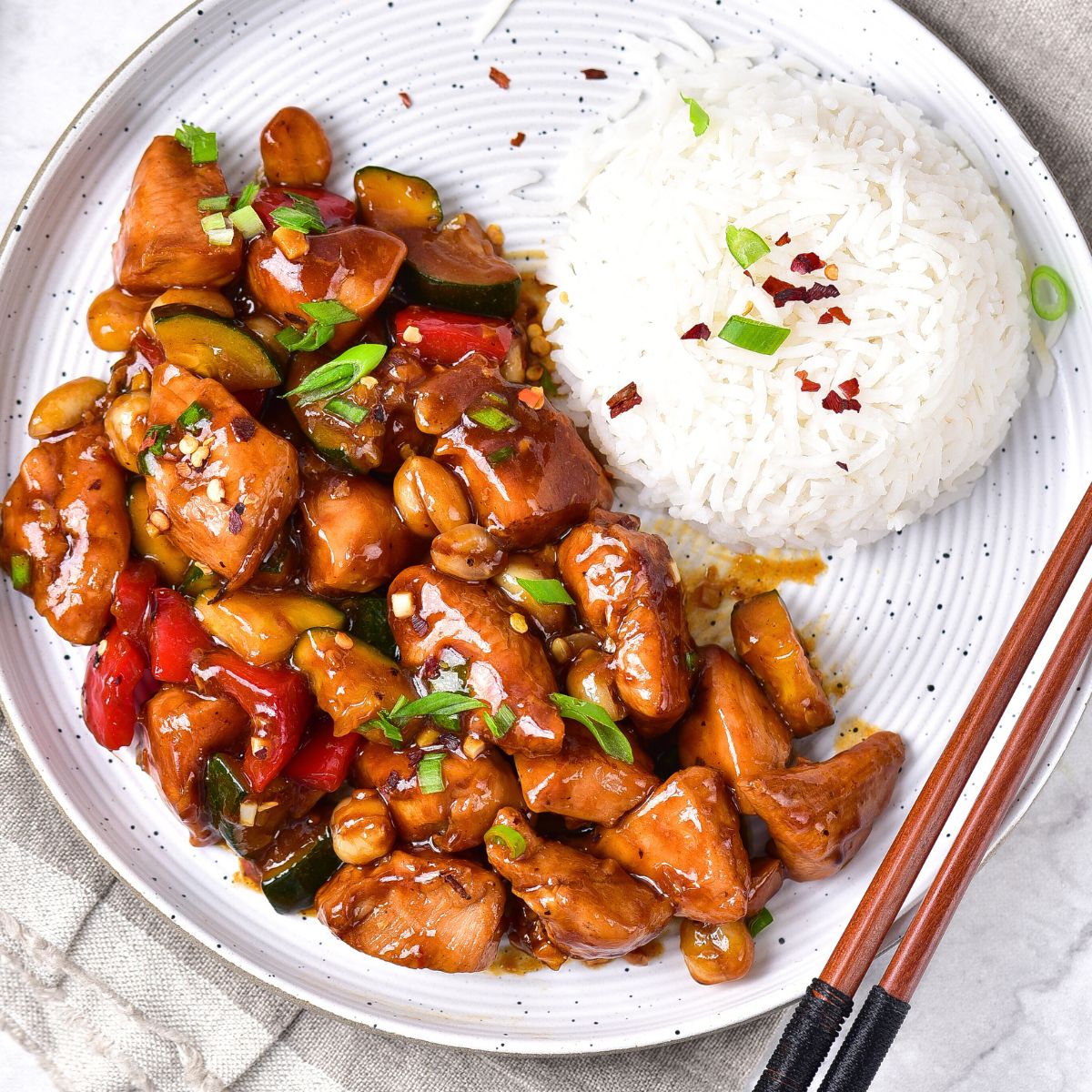 A plate of gluten-free kung pao chicken and rice.