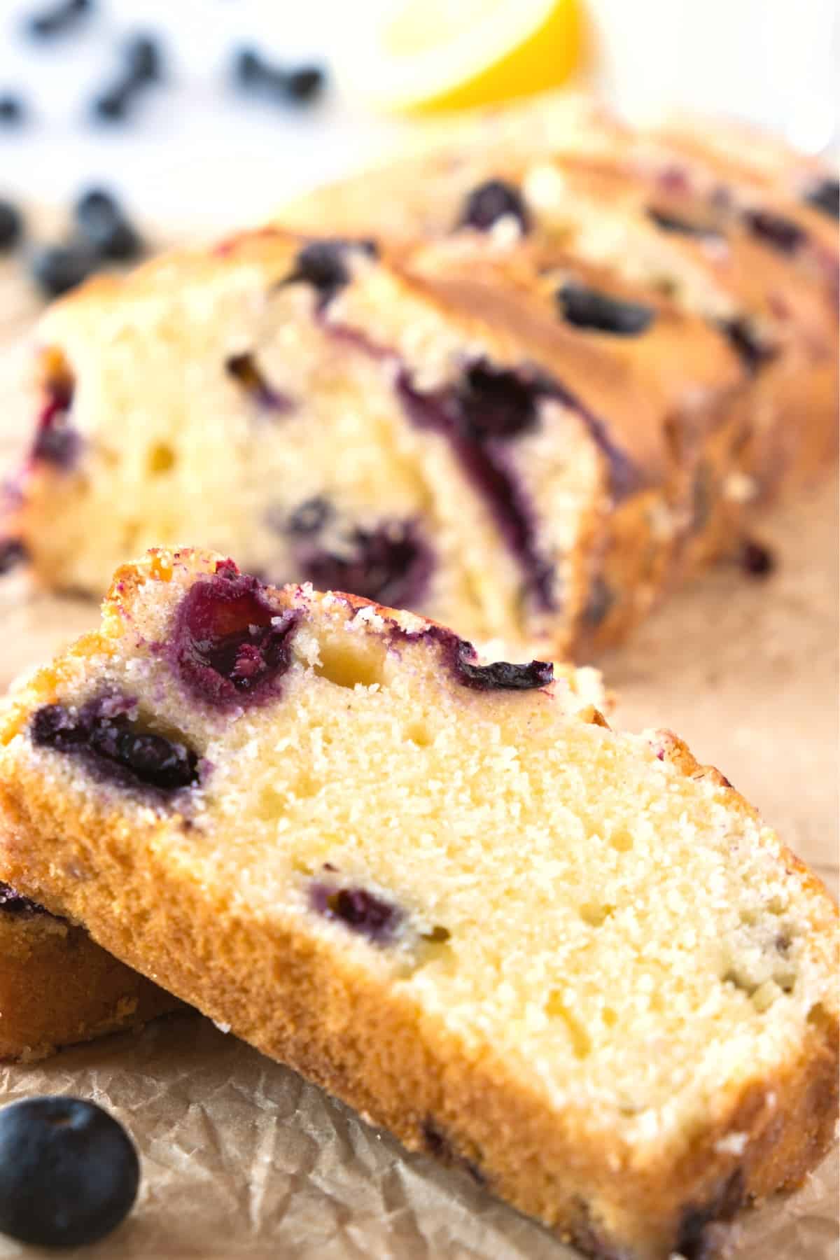 Up close shot of a slice of gluten-free blueberry loaf.