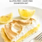 A close up of a slice of lemon meringue pie.