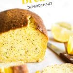 An up close shot of a sliced loaf of lemon poppy seed bread.