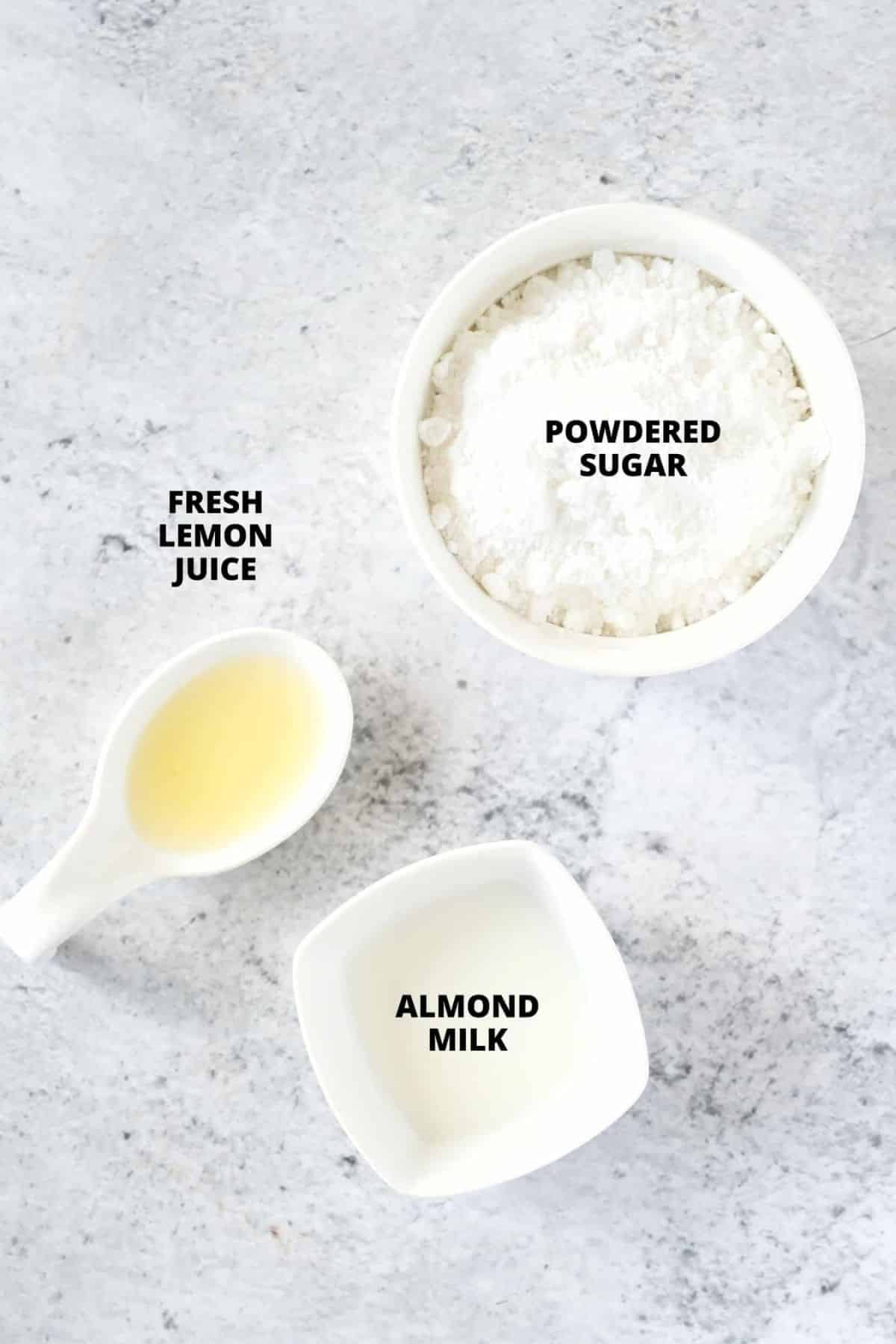 Ingredients for lemon glaze laid out on board.