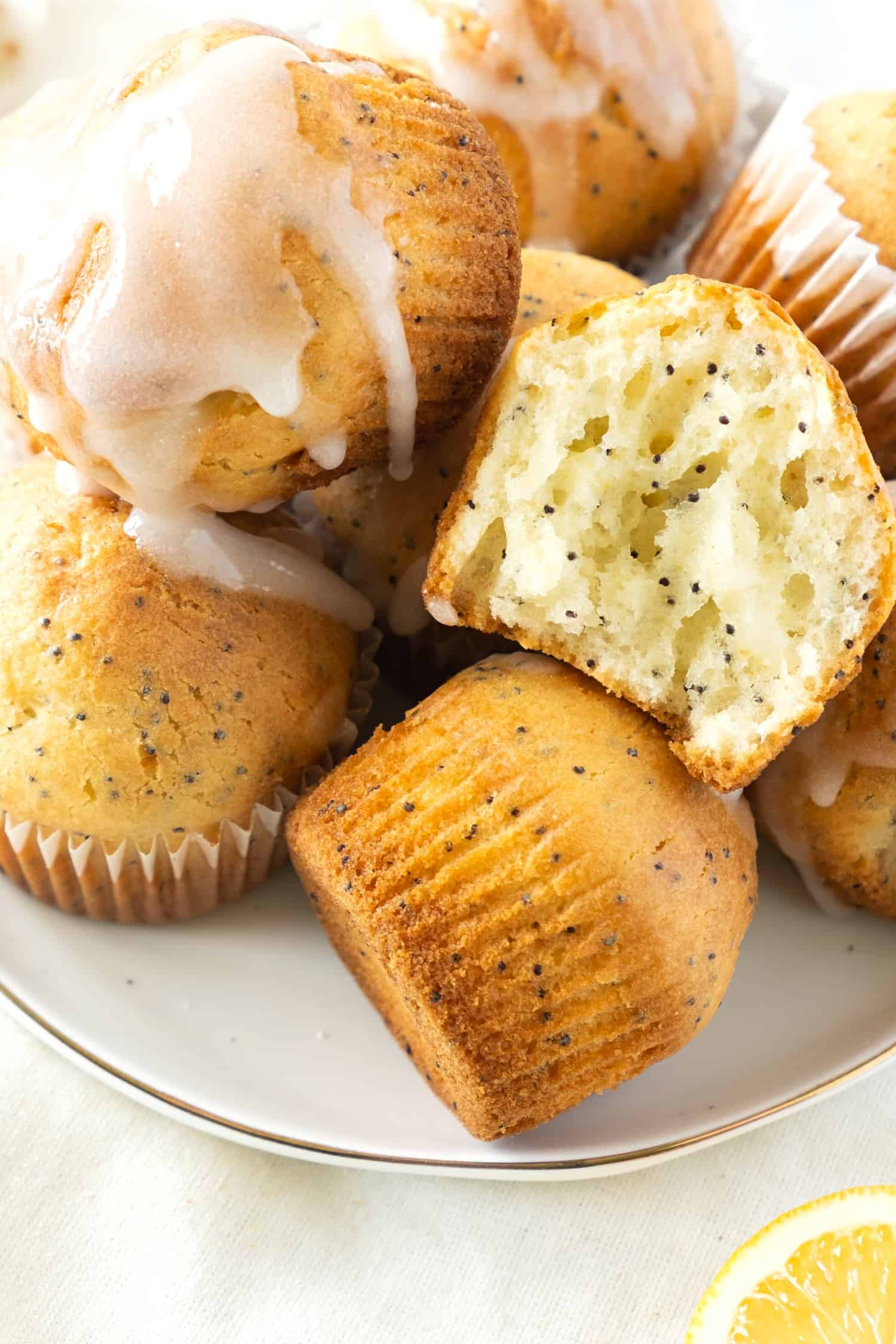 Lemon poppyseed muffins on a plate.